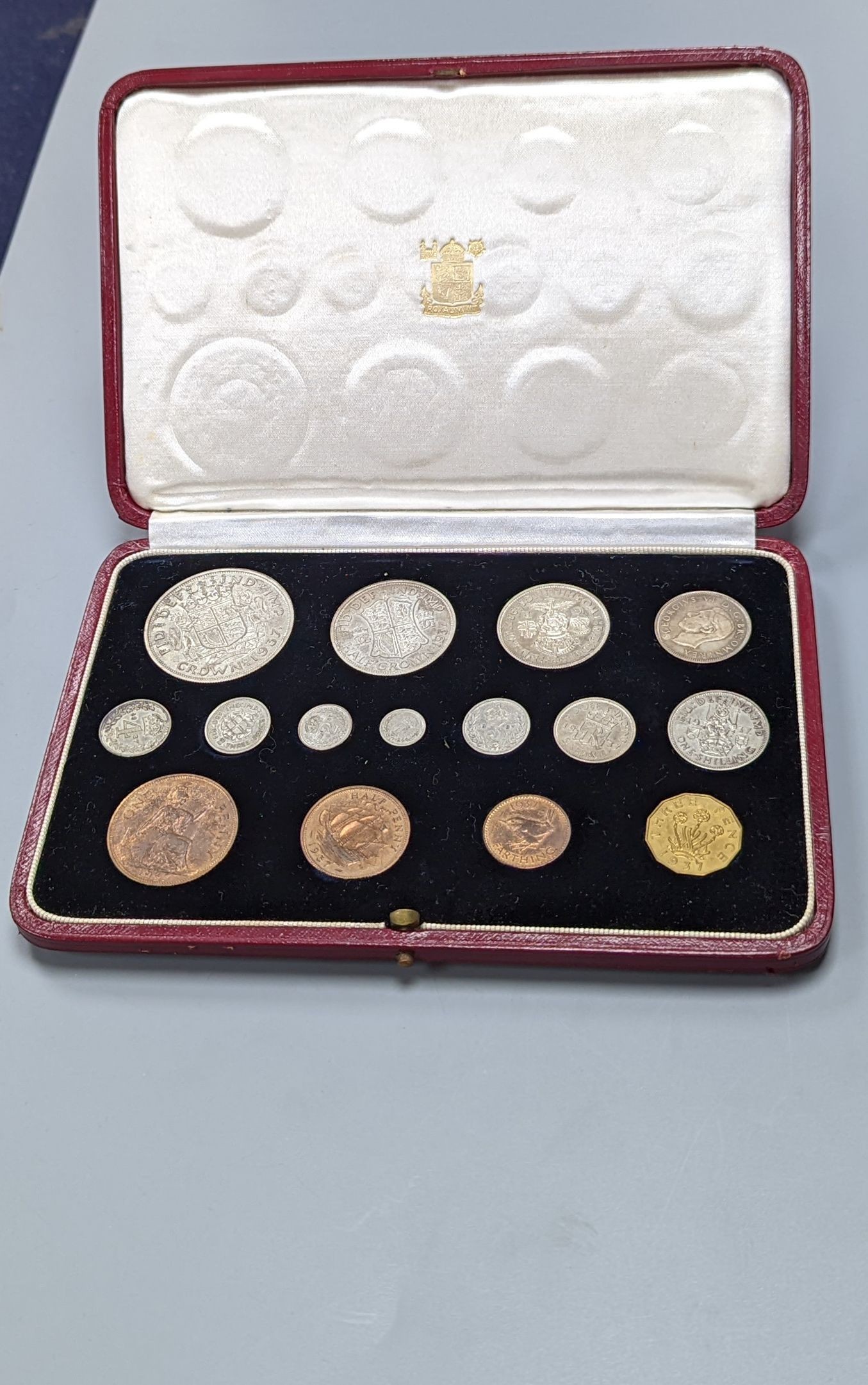 A cased George V coronation year 1937 specimen coin set, all toned UNC.